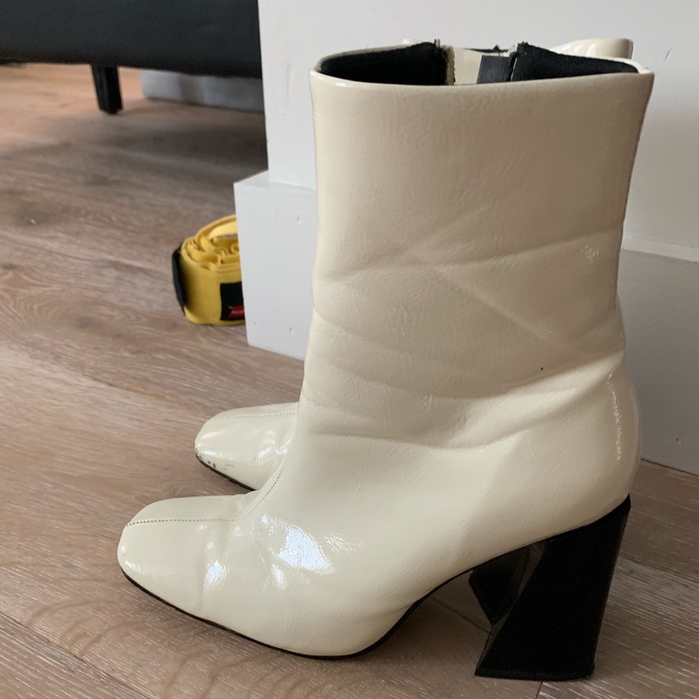 white leather heeled boot